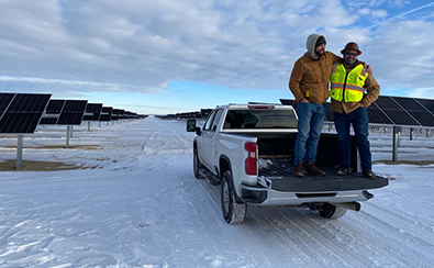 two solar energy epc experts leaving a solar farm